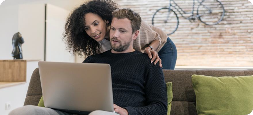 Enroll banner - couple using laptop